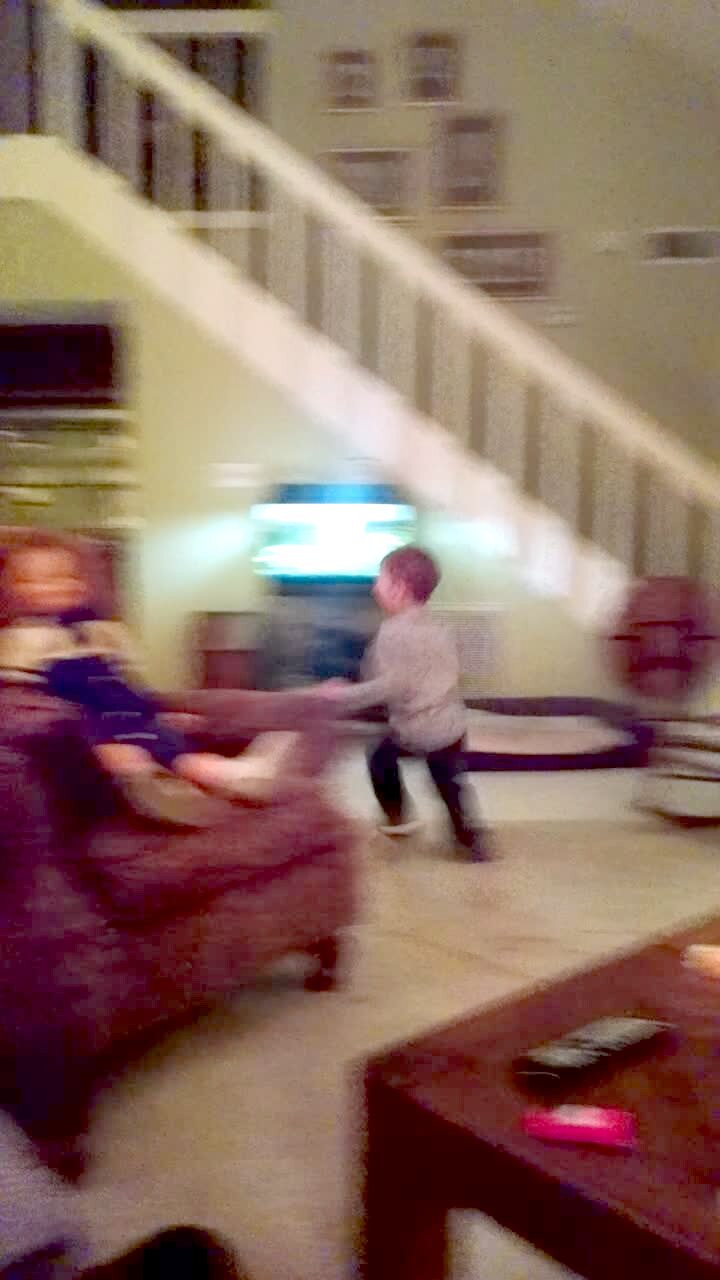 Video thumbnail showing: A boy screams hysterically when he walks around a chair and sees a scary doll sitting in it at home. Practical joke scare